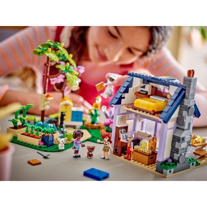 Конструктор LEGO Friends Будиночок і квітник бджолярів (42669) зображення 12