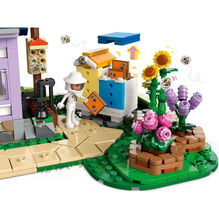 Конструктор LEGO Friends Будиночок і квітник бджолярів (42669) зображення 4